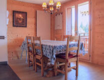 a dining room table in front of a wooden floor